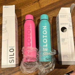 Peloton h2go set of water bottles. BNWT, never used. Pink and blue.